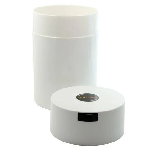 White Coffeevac with lid beside canister