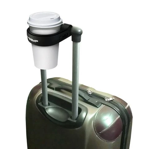LugCup holding coffee on suitcase handle
